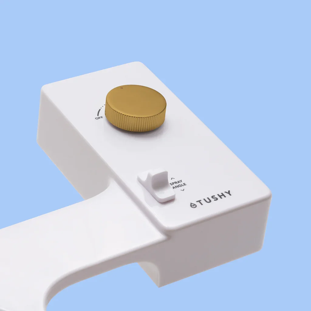 Tushy Classic 3.0 bidet attachment control knob and spray angle slider close-up