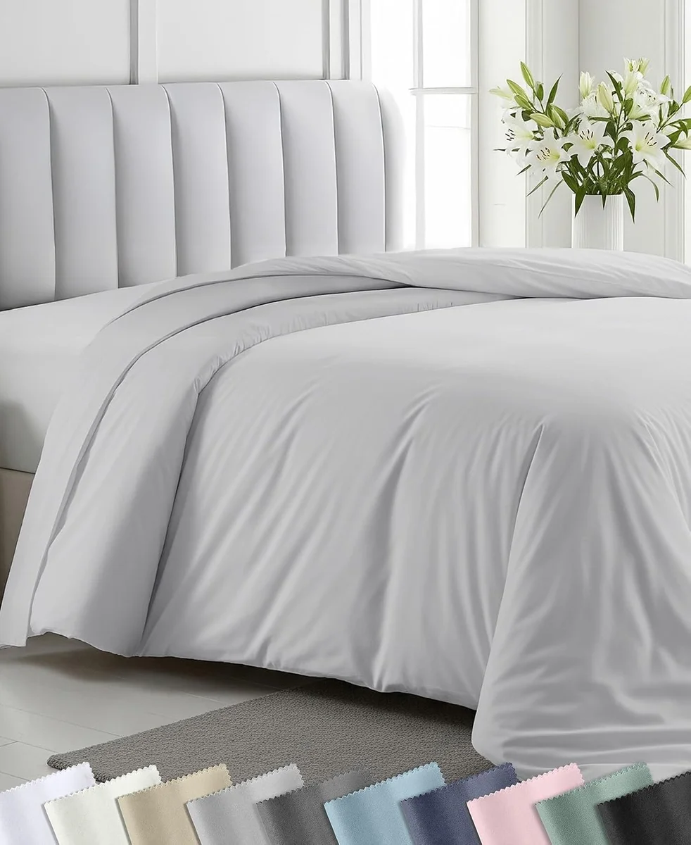 California Design Den cotton sateen duvet cover in light grey showing the soft sheen and drape of the fabric
