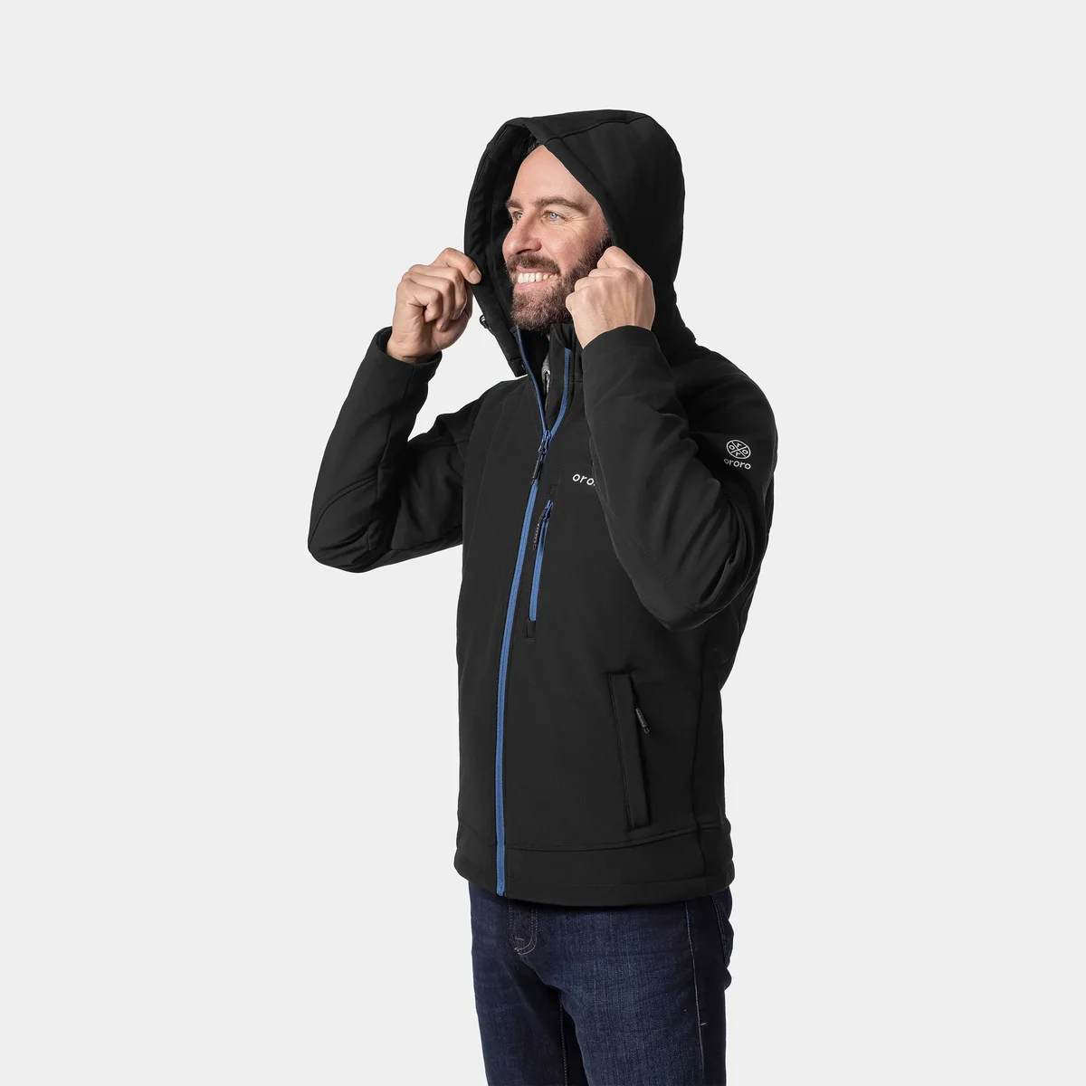 Man pulling up the detachable hood on the black ORORO Men's Classic Heated Jacket, three-quarter view showing the zipped hand pocket and ORORO sleeve logo