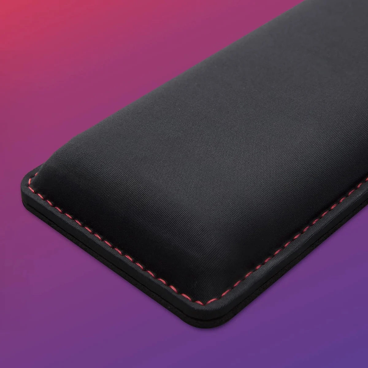 HyperX Wrist Rest close-up of the soft-touch surface and red edge stitching