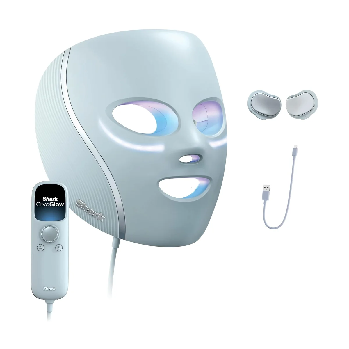 Shark CryoGlow LED Face Mask in Blue Frost at a three-quarter angle with its remote, two under-eye cooling pads and USB charging cable