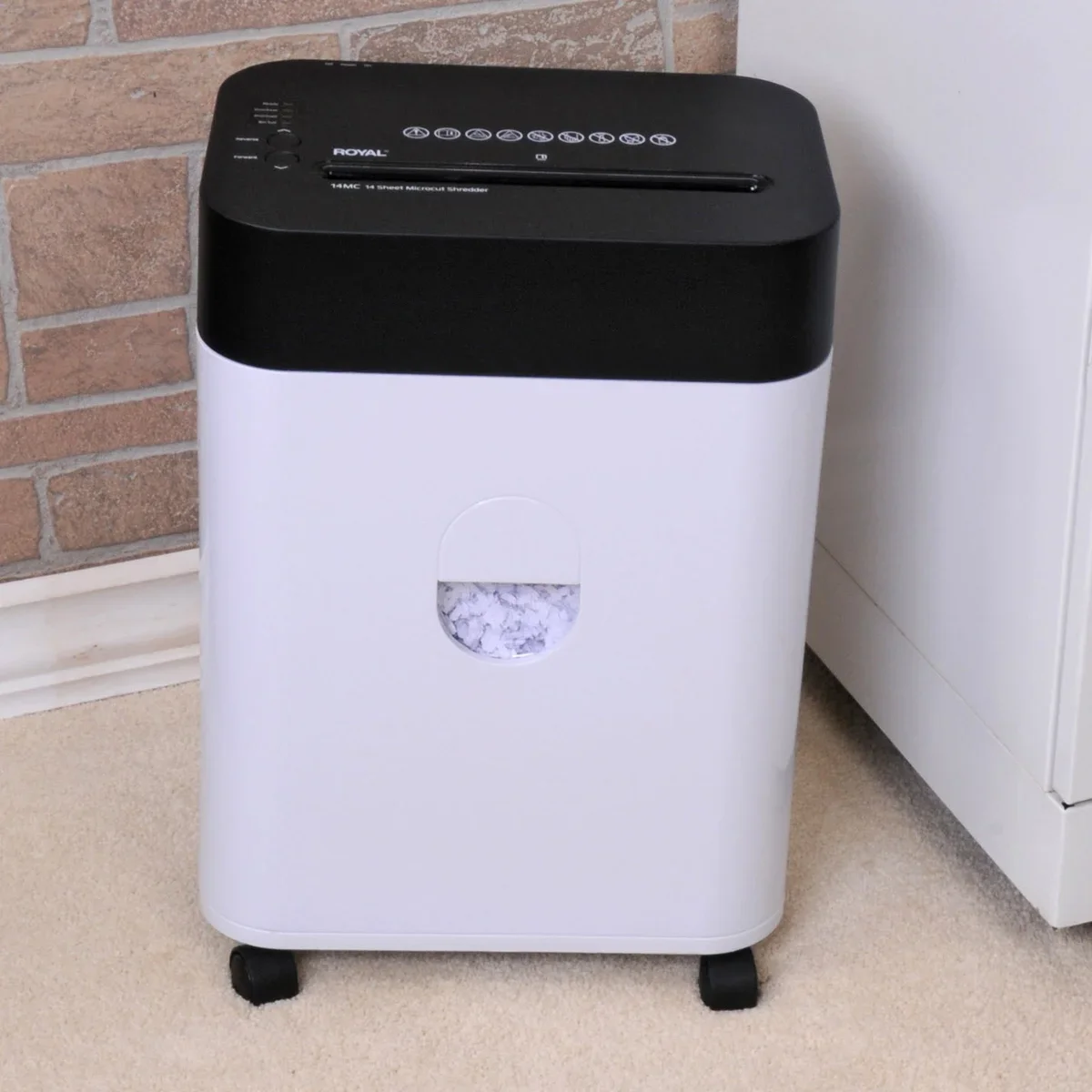 Royal 14MC shredder 3/4-angle view in home office showing micro-cut bin window and casters