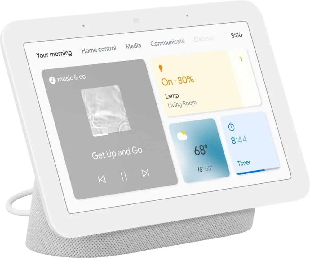 Google Nest Hub (2nd Gen) 3/4 angle view showing the home screen with morning briefing cards