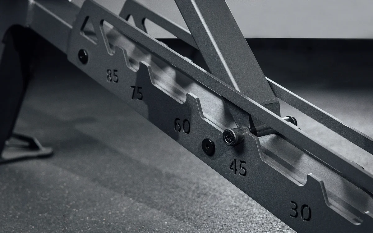 Close-up of the REP Nighthawk Adjustable Bench's enclosed ladder adjustment mechanism showing the numbered back pad angle positions