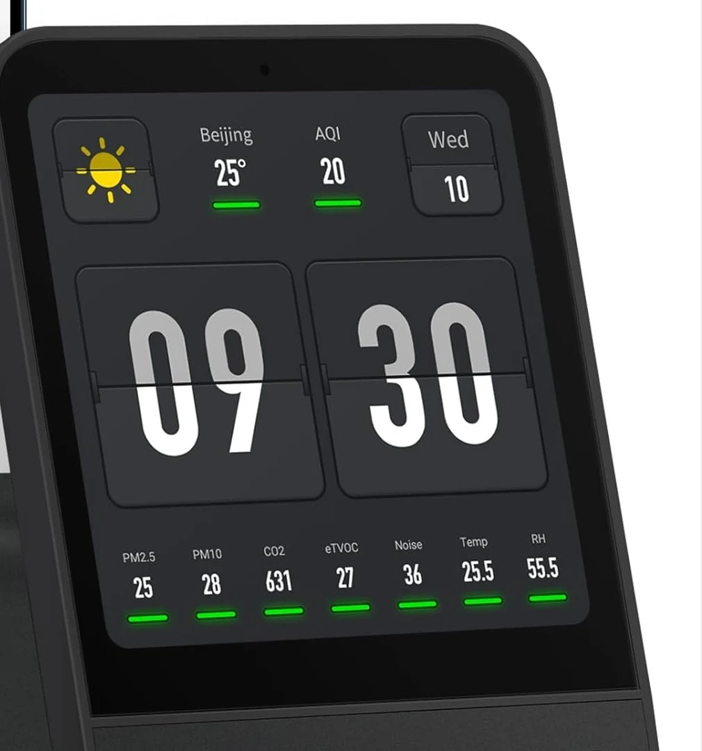 Close-up of the Qingping Air Monitor 2 black unit color touchscreen showing the clock and sensor readouts
