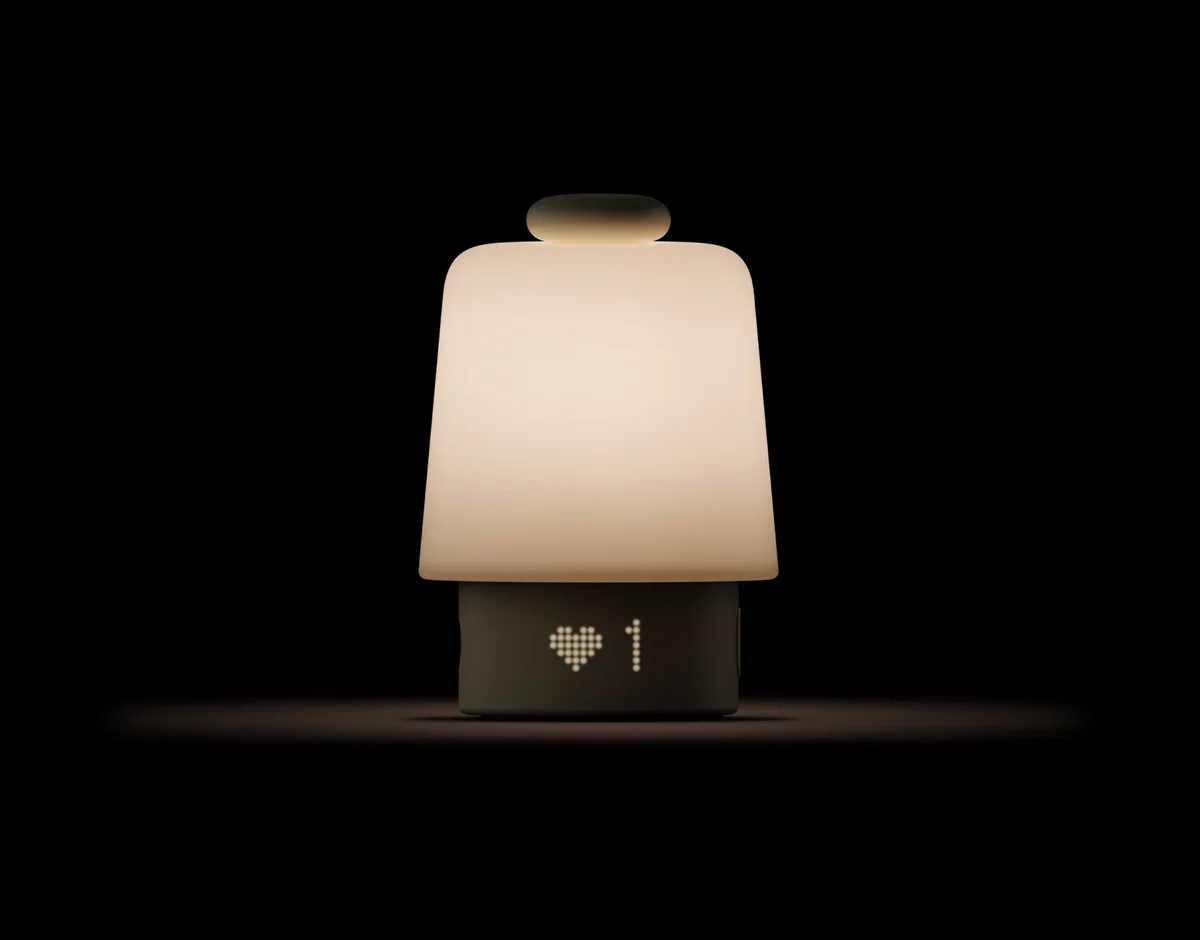 Hatch Baby Rest Gen 2 glowing in a dark room as a night light