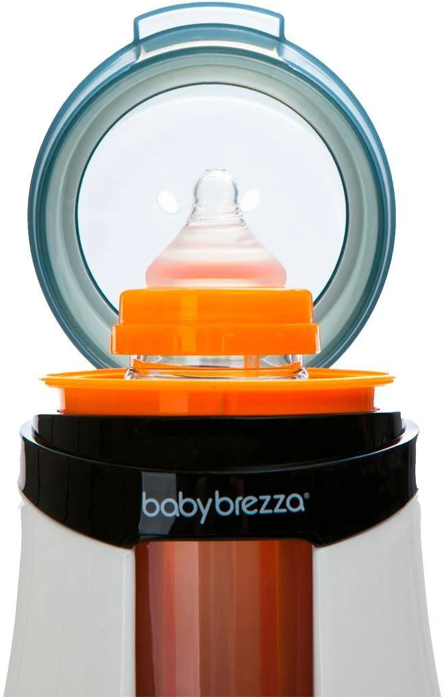 Baby Brezza Safe & Smart Bottle Warmer top opening with bottle and orange adapter ring