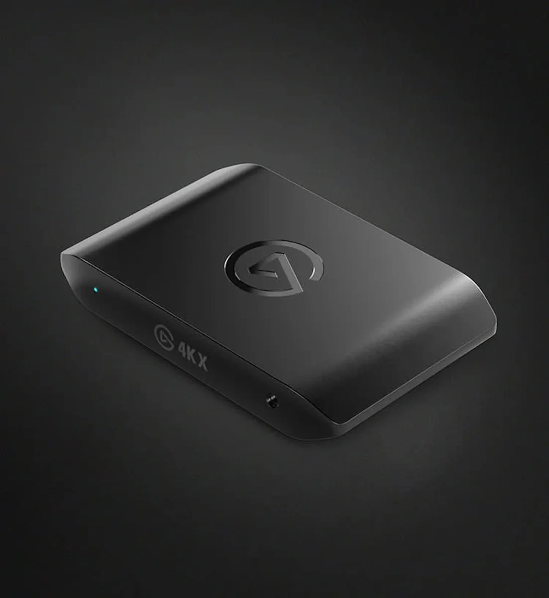 Elgato Game Capture 4K X shown at an alternate top-down angle on a dark studio backdrop, highlighting the matte black chassis and 4K X marking