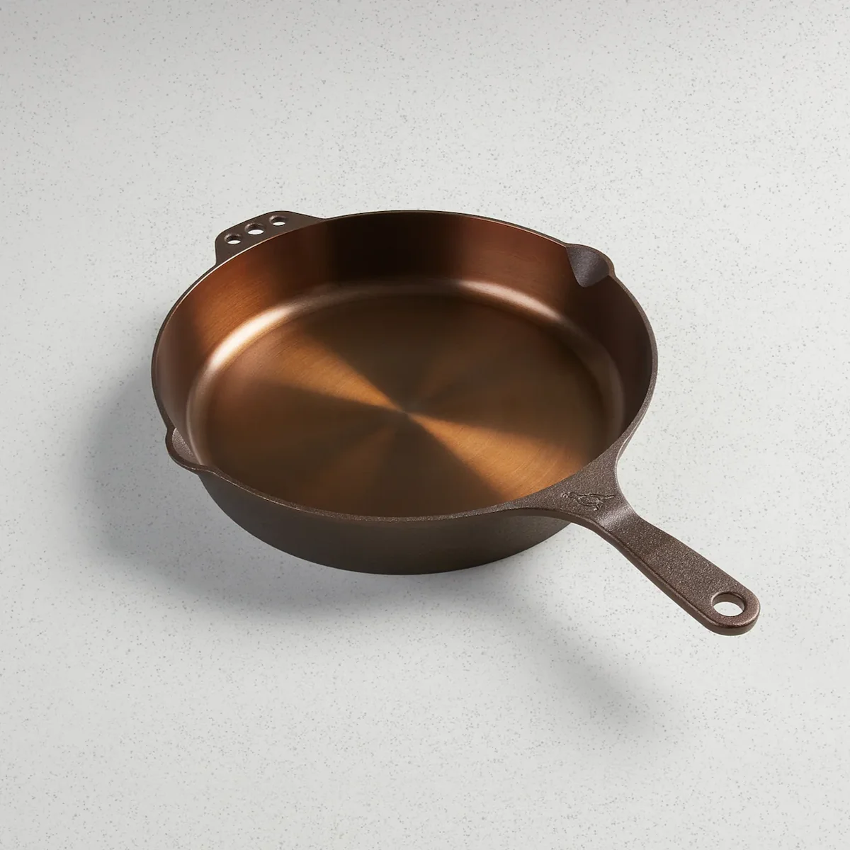 Smithey No. 12 cast iron skillet, three-quarter view on a countertop