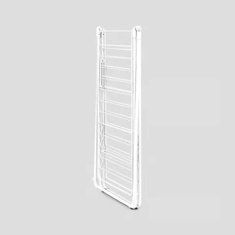 Brabantia HangOn drying rack folded flat for compact storage against a wall