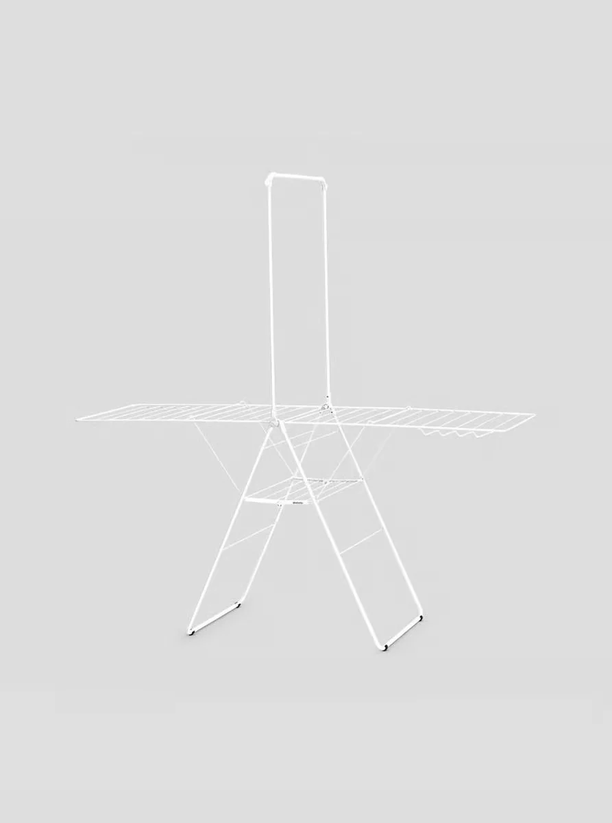 Brabantia HangOn drying rack fully extended, showing the tall white metal frame with fold-out wings and hanger rod