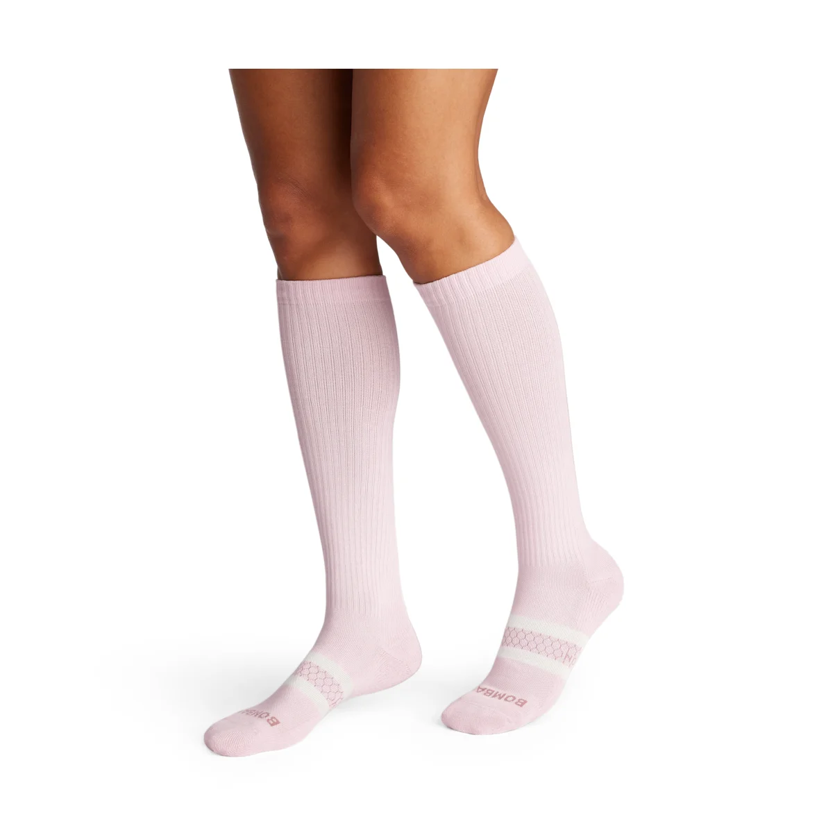 Bombas Everyday Compression Socks in rosewater pink worn on both legs, knee-high fit shown on model