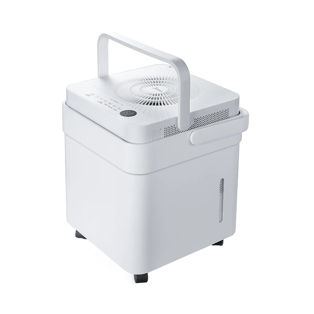 Midea Cube 50-Pint Smart Dehumidifier front 3/4 angle with carry handle raised, showing top control panel and fan grille