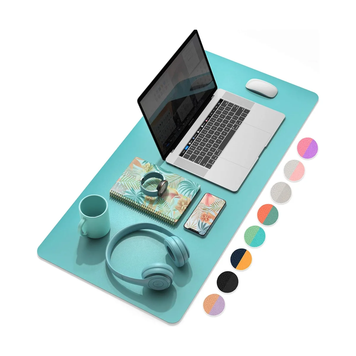 YSAGi desk pad in mint/teal with a laptop, mug and phone, illustrating the reversible color choices
