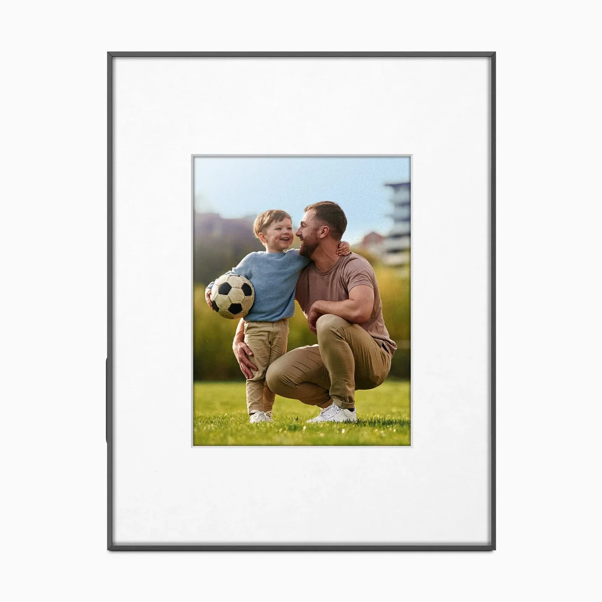 Aluratek ePaper 13.3-inch digital photo frame displaying a family portrait with white matte border