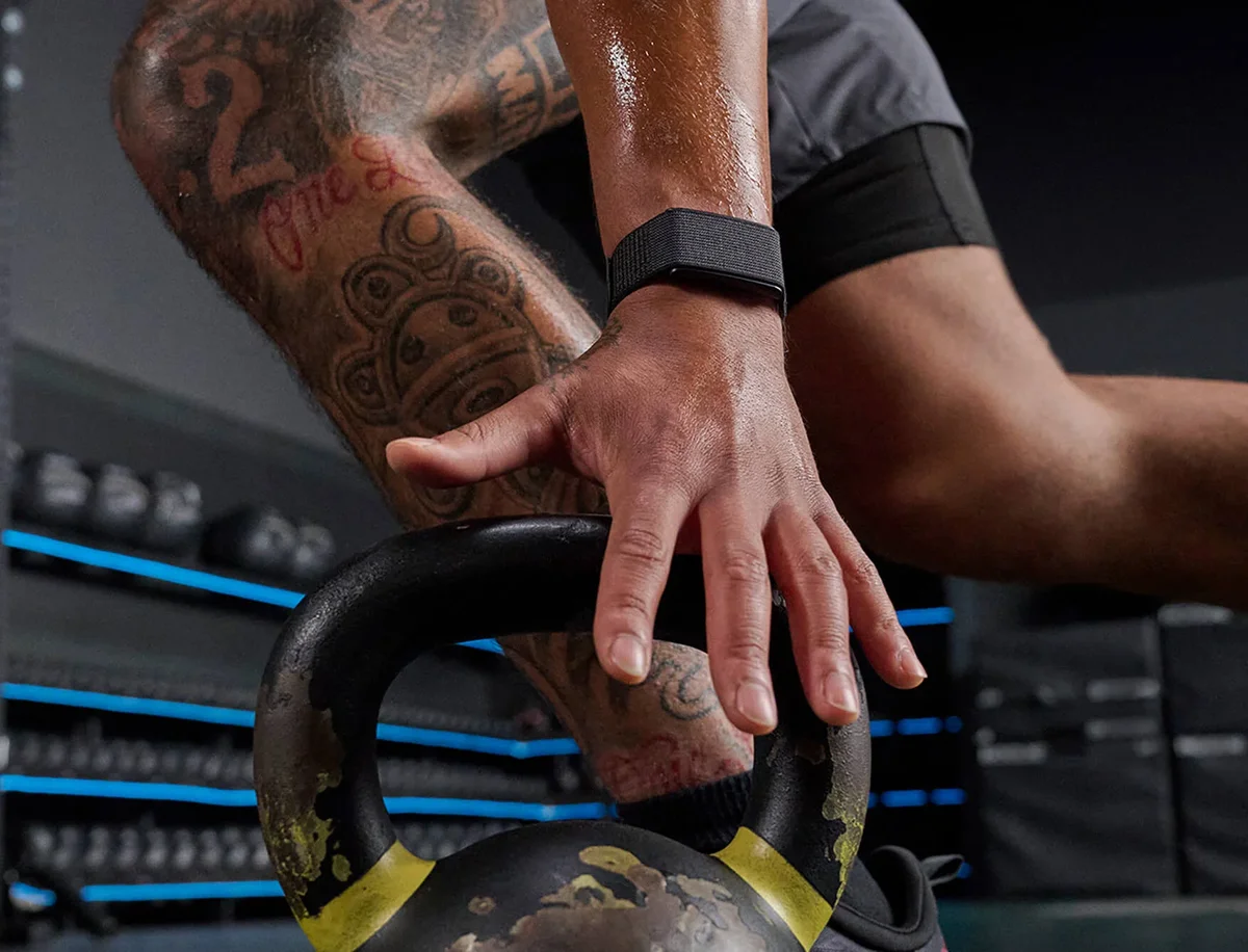Amazfit Helio Band close-up on the wrist resting on a kettlebell