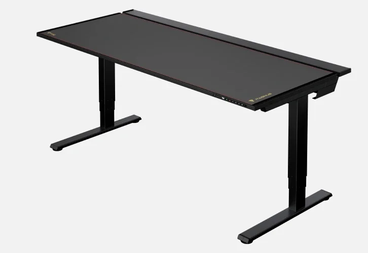 Secretlab Magnus Pro gaming desk isolated 3/4 view showing dark steel surface, black powder-coated frame, and front cable management trough