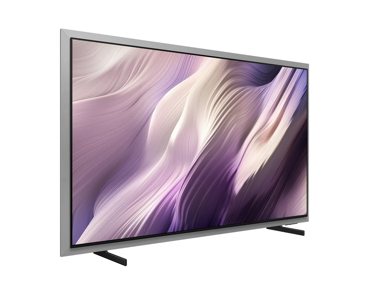 Samsung S95H 65-inch OLED TV three-quarter view showing the silver metal frame and stand feet