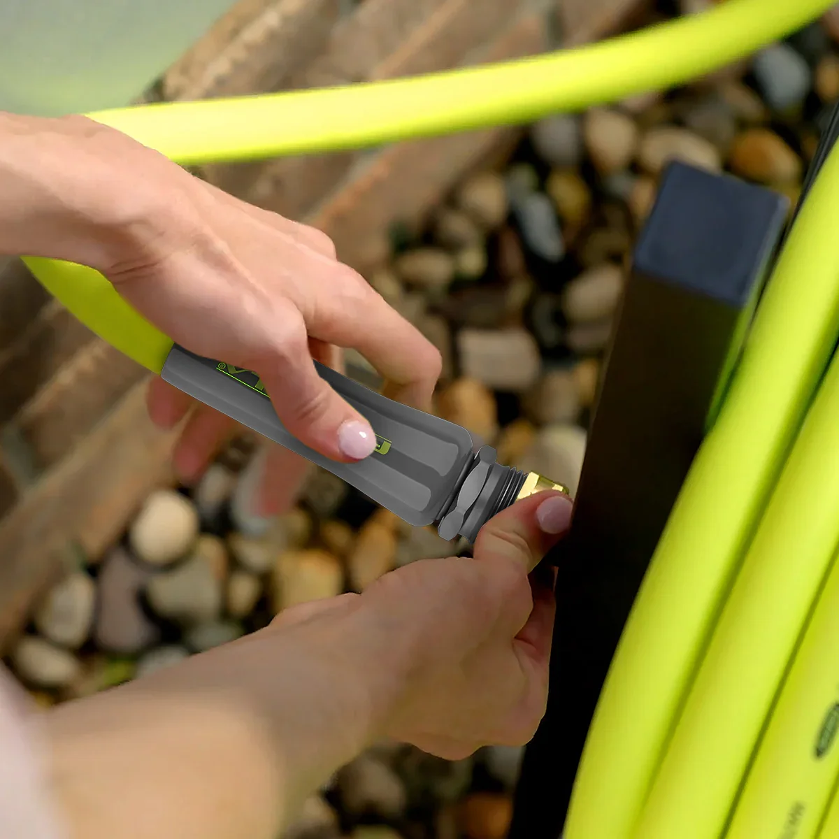 Flexzilla Garden Hose fitting being connected by hand, showing lightweight easy-grip design