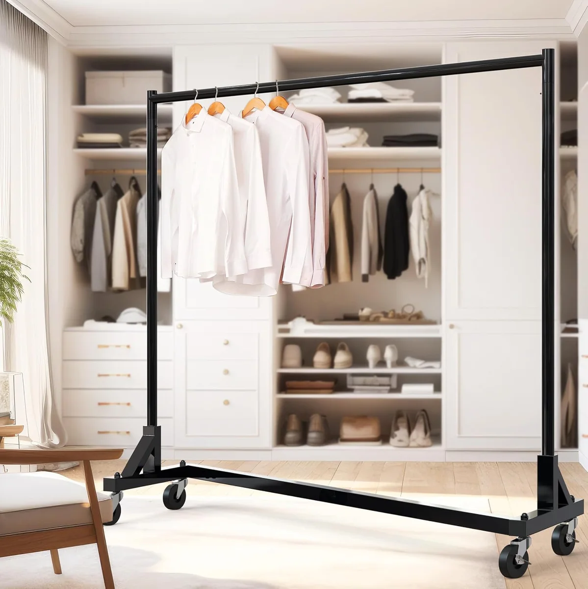 Simple Houseware black Z-Base Garment Rack holding white dress shirts in a walk-in closet, showing the Z-shaped base and locking casters