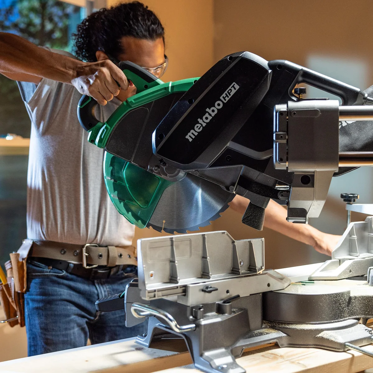 Metabo HPT C12RSH3 in use, woodworker making a cut in a workshop environment