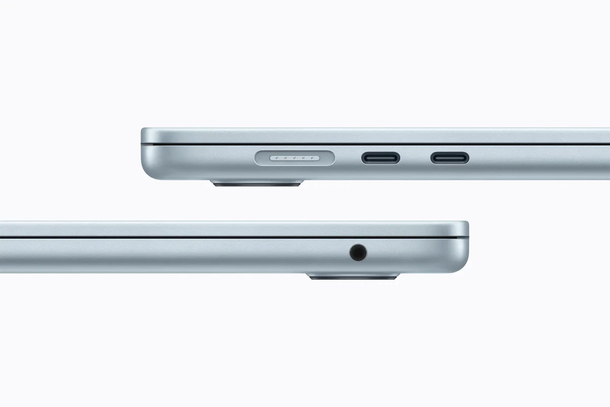 Apple MacBook Air (M5) in Sky Blue side profiles showing the MagSafe port, two Thunderbolt/USB-C ports and the headphone jack