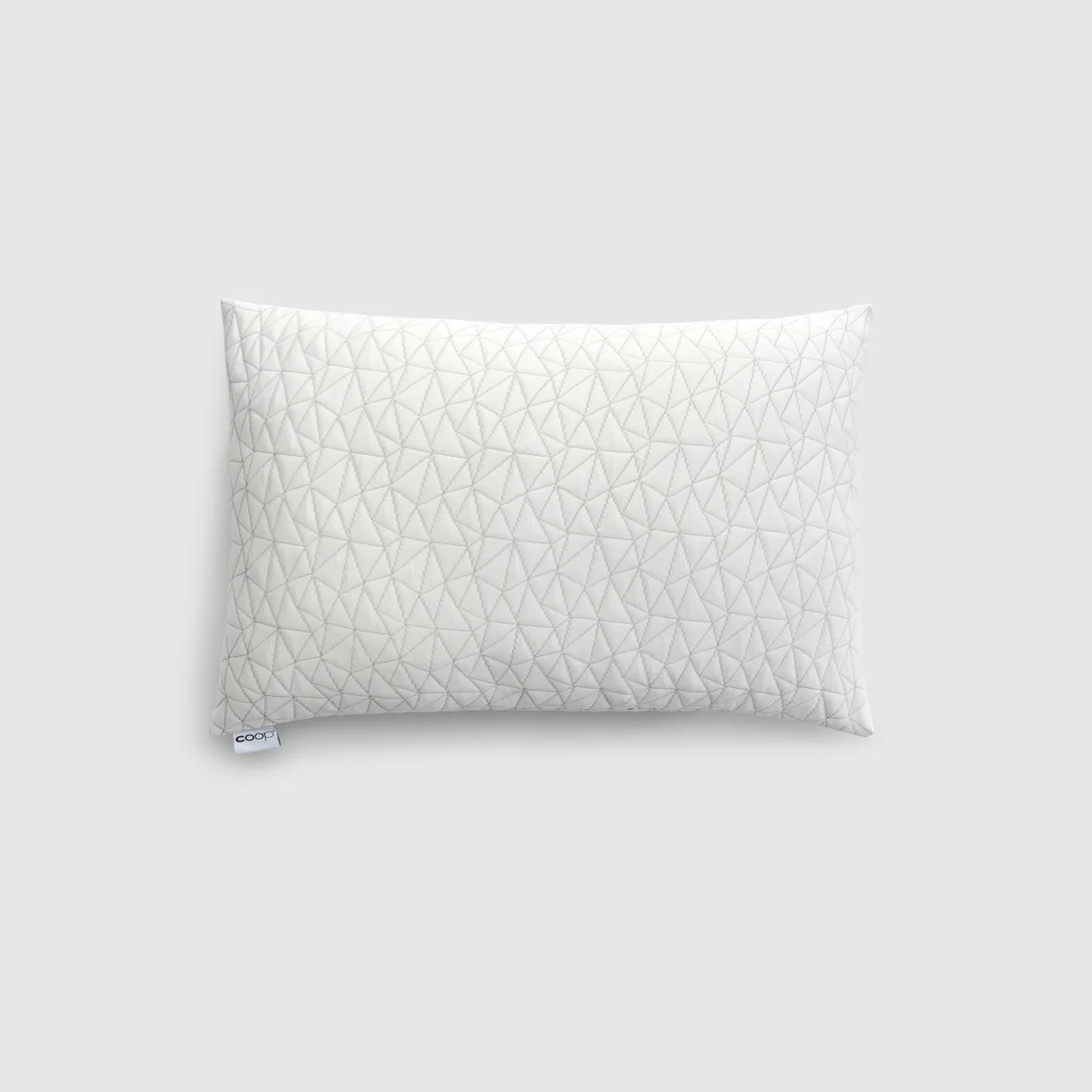 Coop Sleep Goods Original Adjustable Pillow front view showing the quilted triangle-stitch cover and Coop tag
