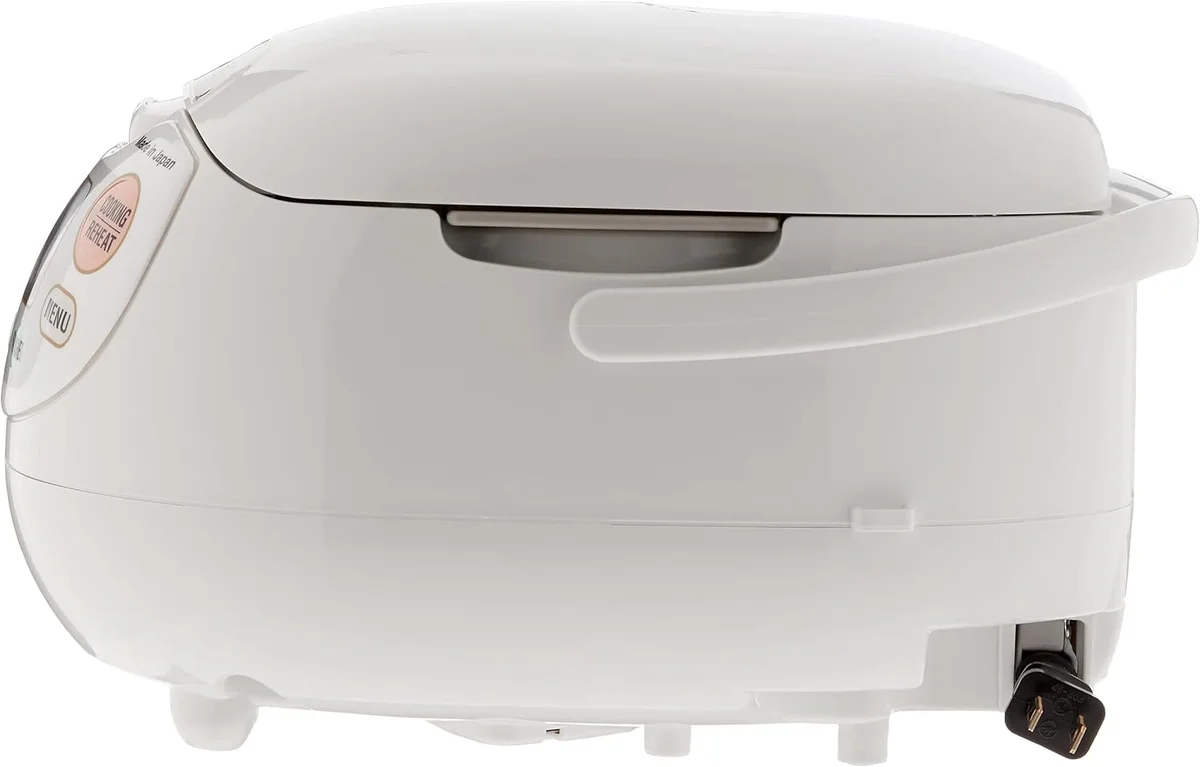 Zojirushi NS-ZCC10 rice cooker side profile showing handle, power cord socket, and lid seam