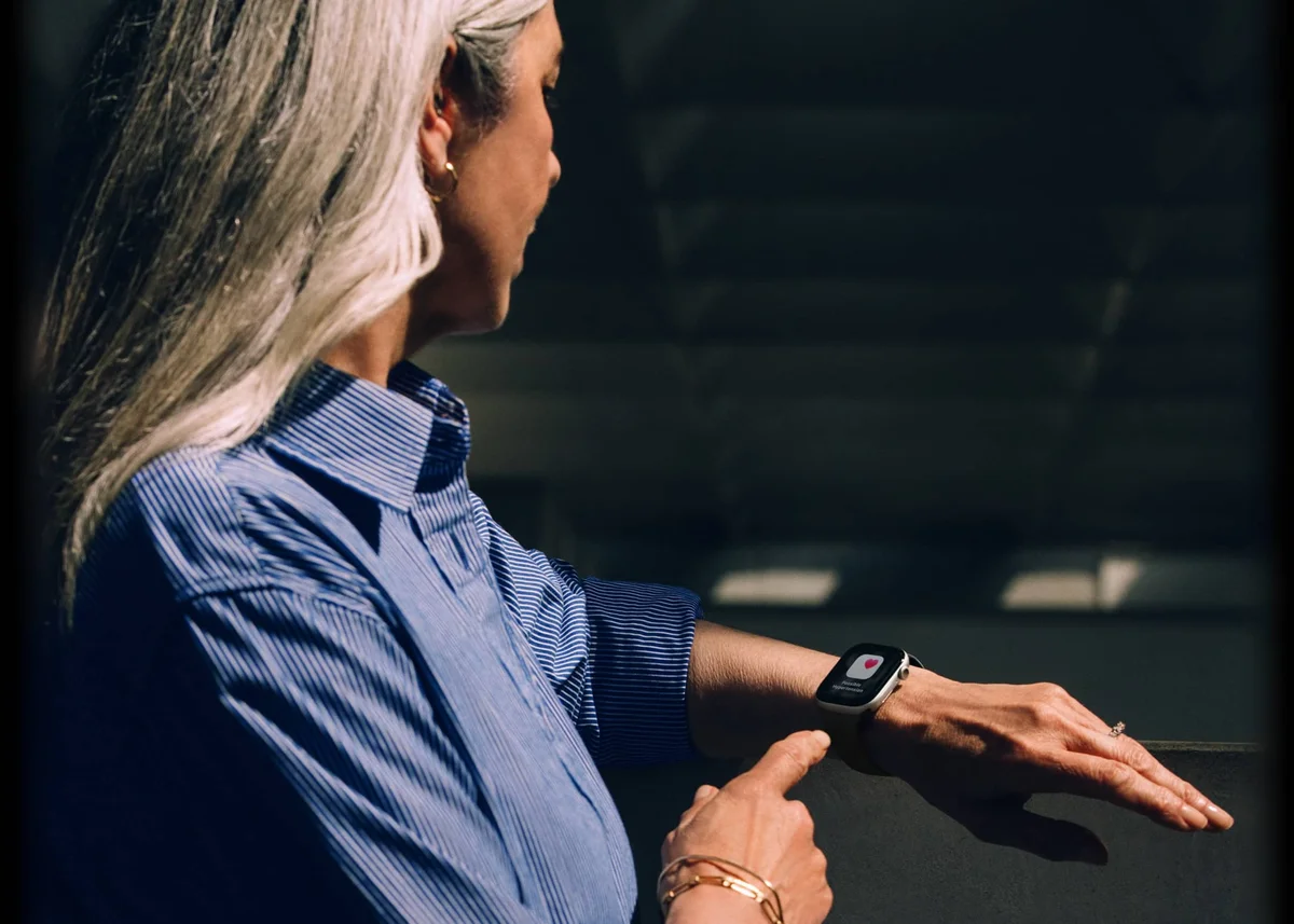 Apple Watch Series 11 on a woman's wrist displaying a hypertension notification, highlighting the watch's health monitoring features