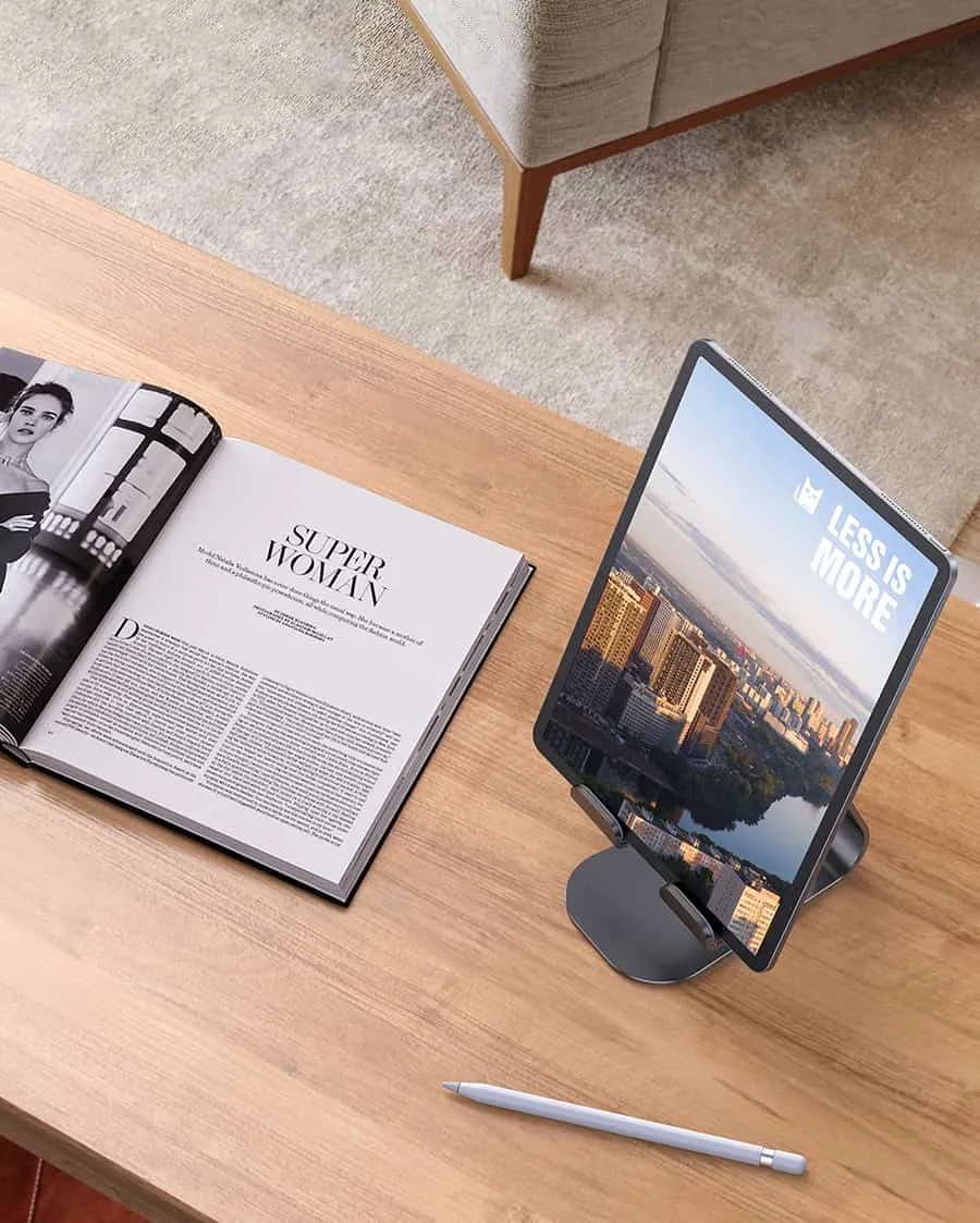 Lamicall Tablet Stand in use on a wooden desk with an iPad, Apple Pencil, and open magazine