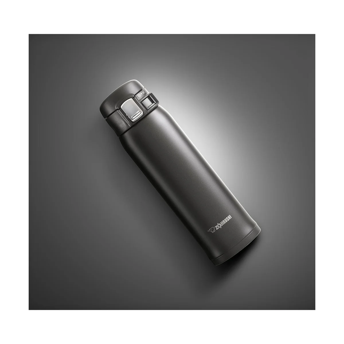Zojirushi SM-SHE48 travel mug shown diagonally on dark background