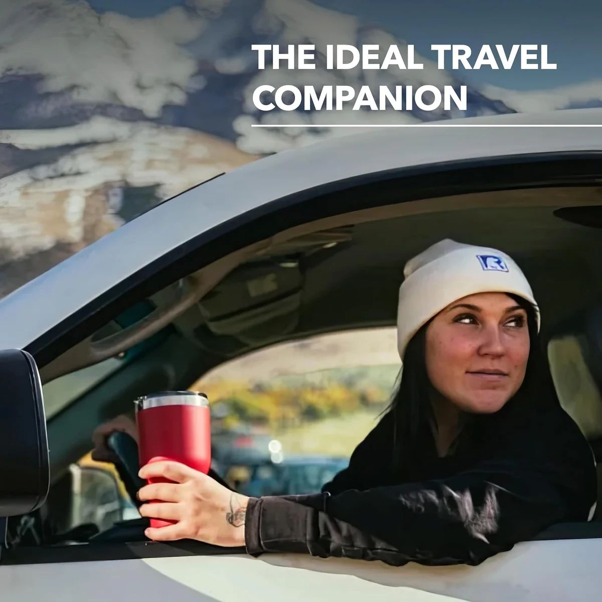 RTIC 30 oz Tumbler held out a car window during outdoor travel