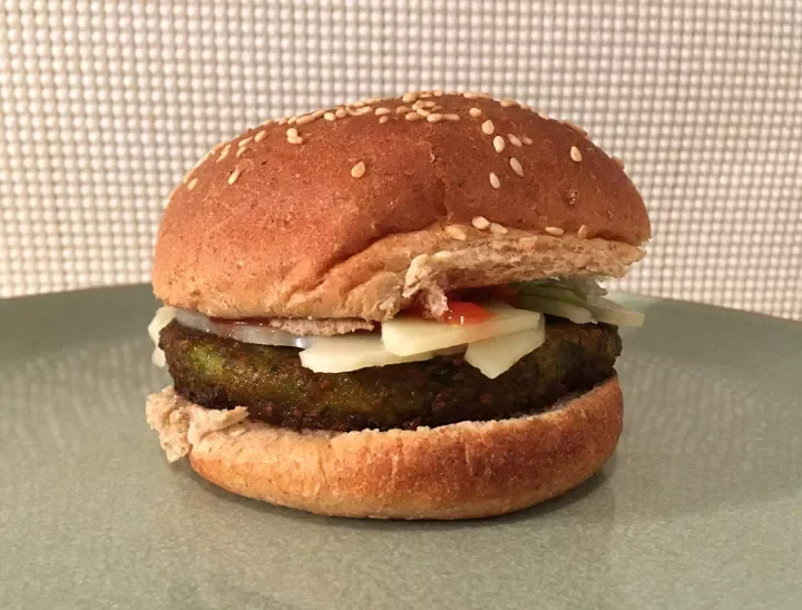 Dr. Praeger's California Veggie Burger assembled on a sesame bun with toppings