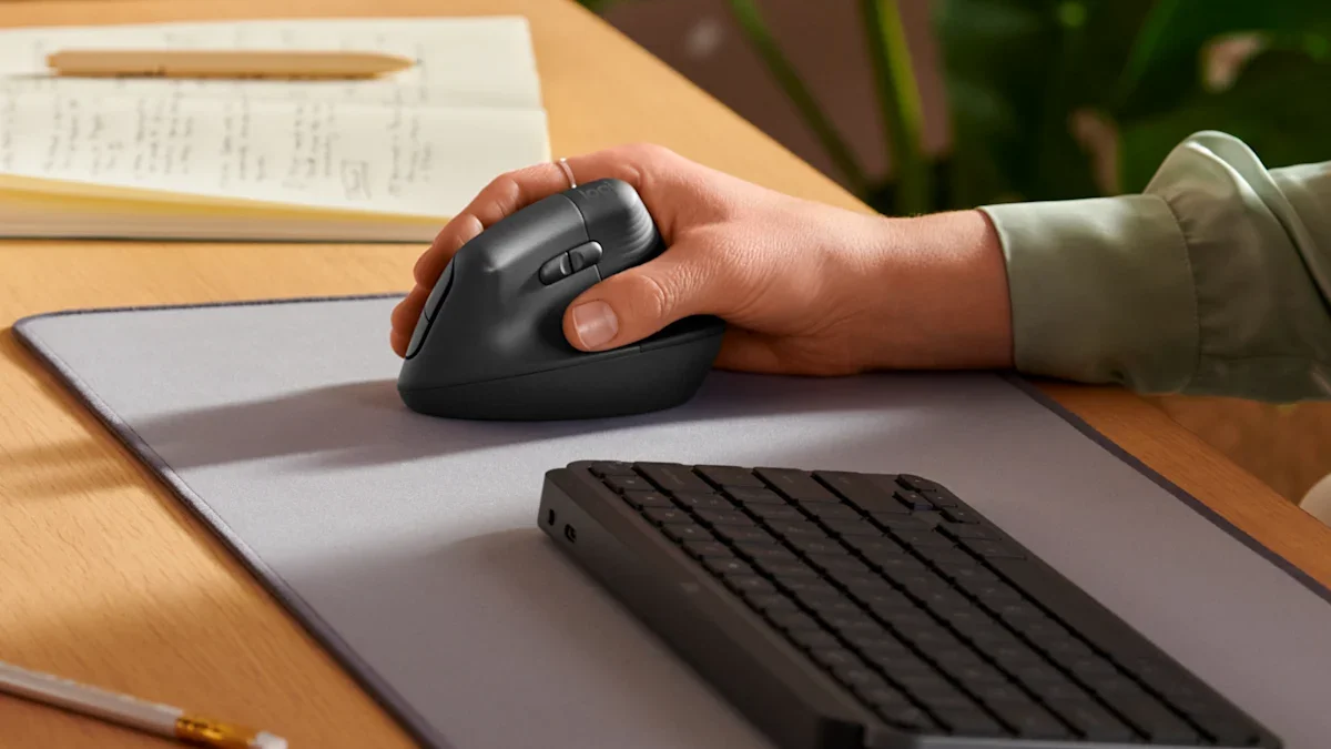 Logitech Lift on a desk mat beside a keyboard in a home office