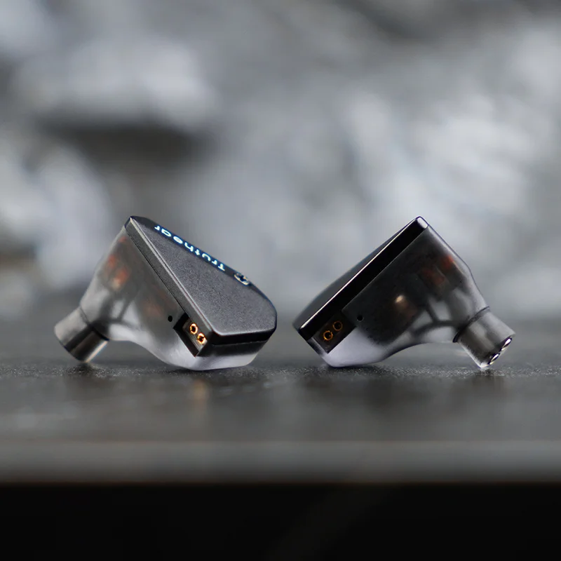 Close-up of Truthear Hexa translucent smoke resin shells and gold-pin 2-pin connectors