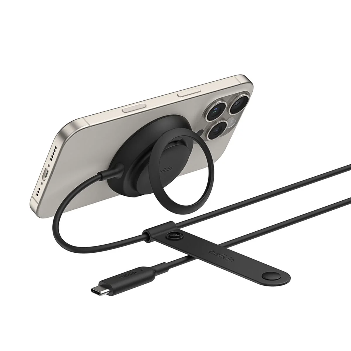 Belkin UltraCharge Magnetic Charger holding an iPhone at an angle on its kickstand, tethered USB-C cable visible